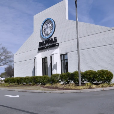 Front view of Pappas Orthodontics building entrance with clear signage and landscaping.